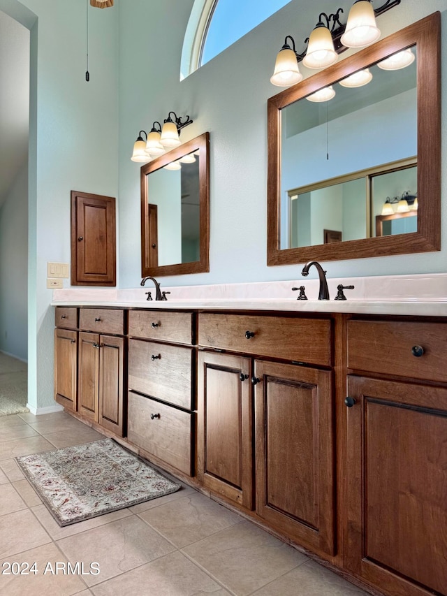 bathroom featuring tile patterned flooring and vanity