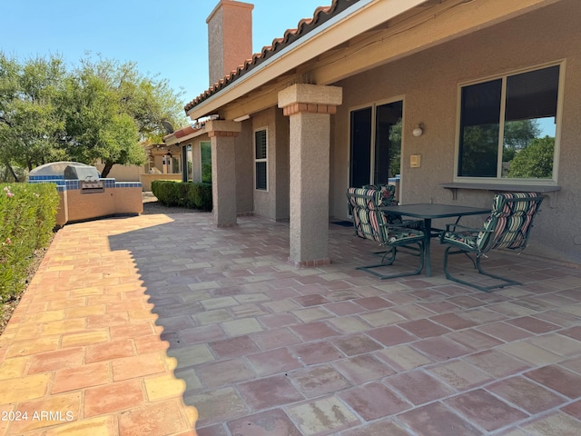 view of patio with an outdoor kitchen