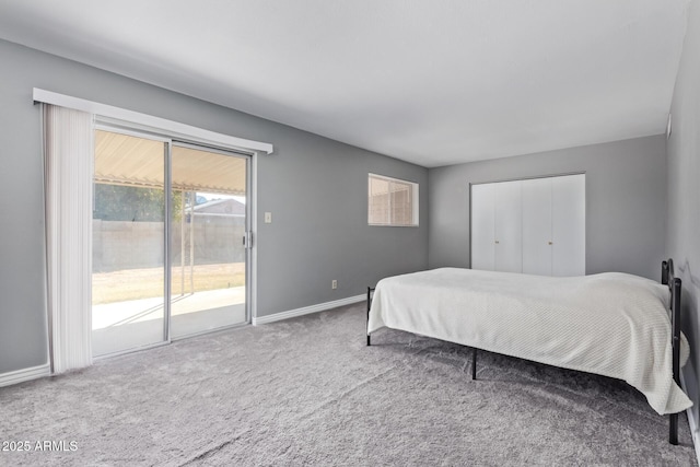 bedroom featuring access to exterior and carpet floors