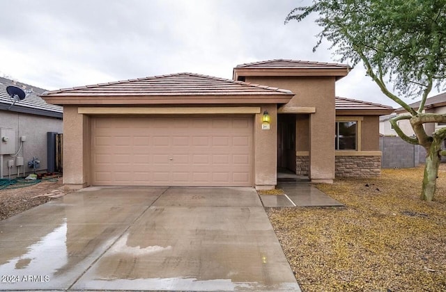 prairie-style home featuring a garage