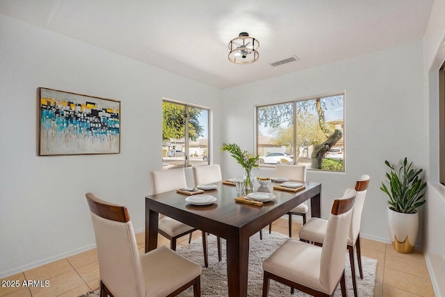 dining area with light tile patterned flooring