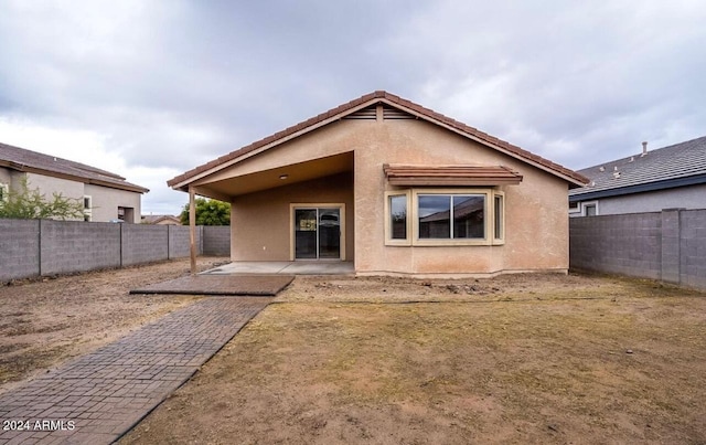 back of house featuring a patio