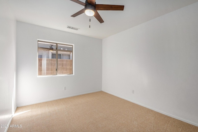 unfurnished room with ceiling fan and carpet flooring