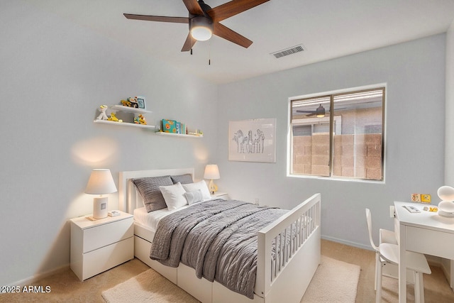 carpeted bedroom with ceiling fan