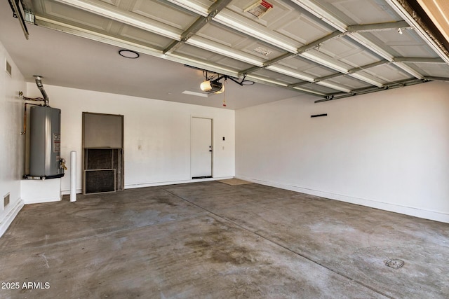 garage with a garage door opener and water heater