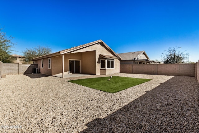 rear view of house featuring a patio