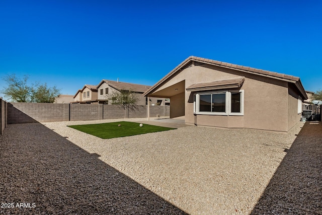 rear view of property with a patio area