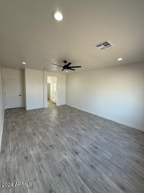 spare room with visible vents, baseboards, ceiling fan, recessed lighting, and wood finished floors