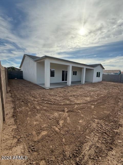 back of property with a patio area