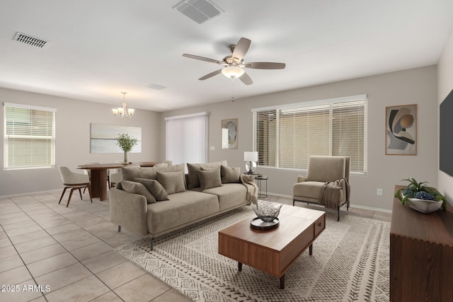 5113 E Greenway St E, Mesa, AZ 85205 - living area featuring light tile patterned floors, a chandelier, and ceiling fan