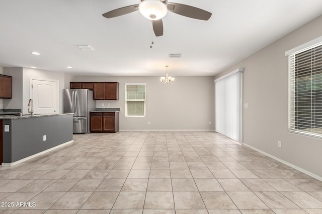 5113 E Greenway St E, Mesa, AZ 85205 - kitchen featuring freestanding refrigerator, light tile patterned flooring, a chandelier, a ceiling fan, and recessed lighting