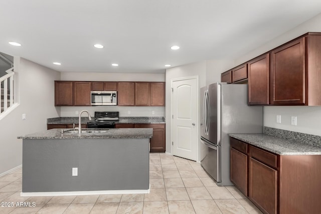 5113 E Greenway St E, Mesa, AZ 85205 - kitchen featuring appliances with stainless steel finishes, recessed lighting, light tile patterned floors, an island with sink, and light stone countertops