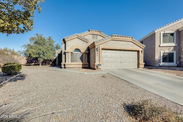 view of front of property featuring a garage