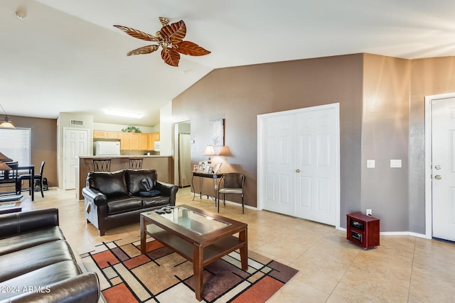 living room featuring vaulted ceiling, ceiling fan, and light tile patterned flooring