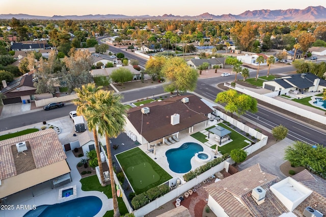 aerial view at dusk with a residential view and a mountain view