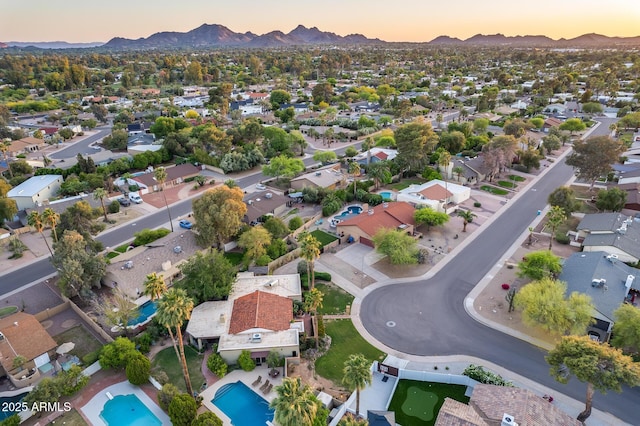 aerial view at dusk with a residential view and a mountain view
