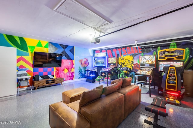 game room featuring a garage and wallpapered walls