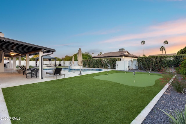 view of yard with a gazebo, a fenced backyard, a patio area, and a fenced in pool