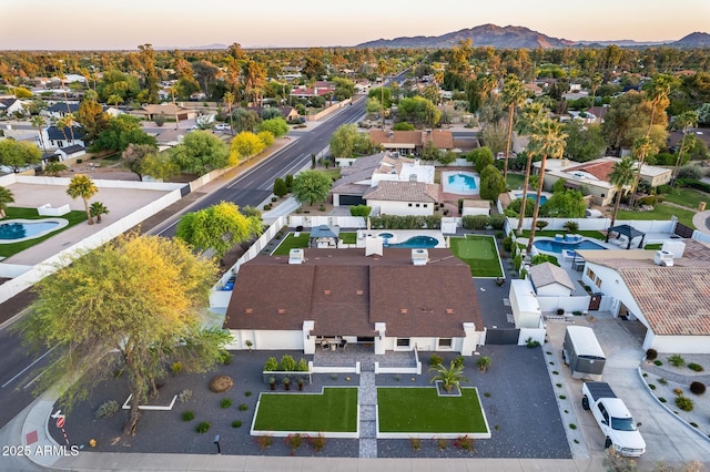 aerial view at dusk with a residential view and a mountain view