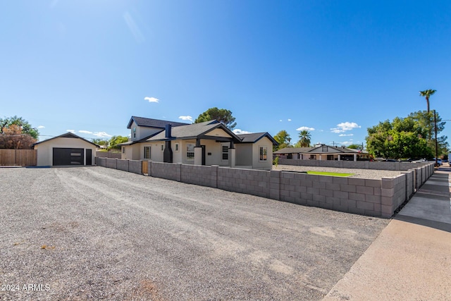 1921 E Yale St, Phoenix, AZ 85006 - view of front of home featuring a garage, gravel driveway, and an outdoor structure