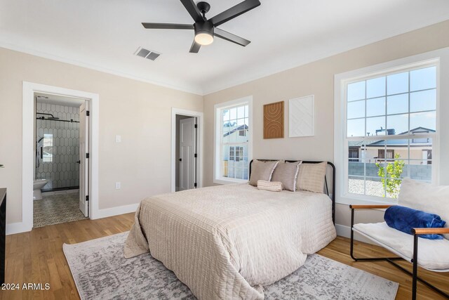 1921 E Yale St, Phoenix, AZ 85006 - bedroom with wood finished floors, connected bathroom, a ceiling fan, and crown molding