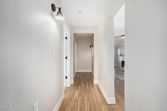 hall with light wood-type flooring