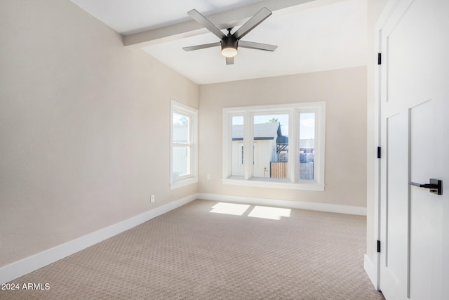 carpeted spare room with beam ceiling and ceiling fan