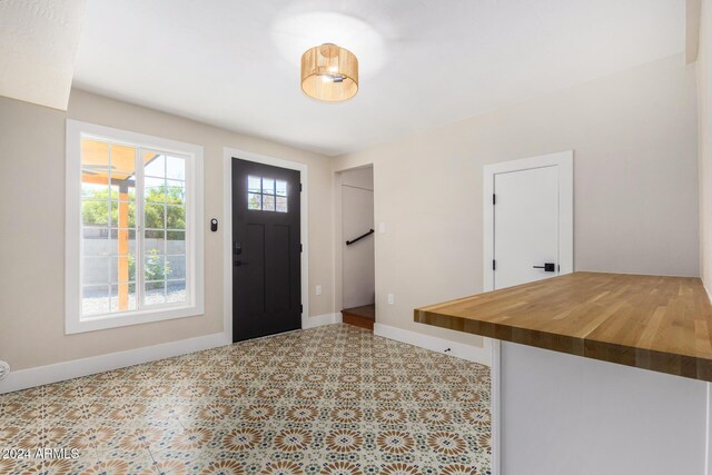 1921 E Yale St, Phoenix, AZ 85006 - foyer with baseboards and tile patterned floors