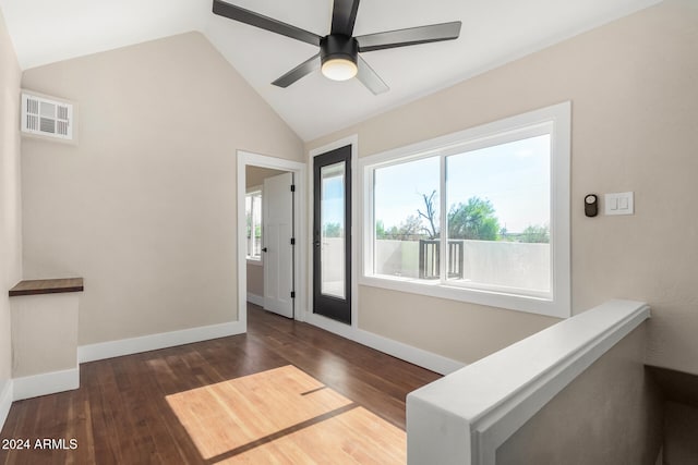 interior space with ceiling fan, dark hardwood / wood-style flooring, and vaulted ceiling