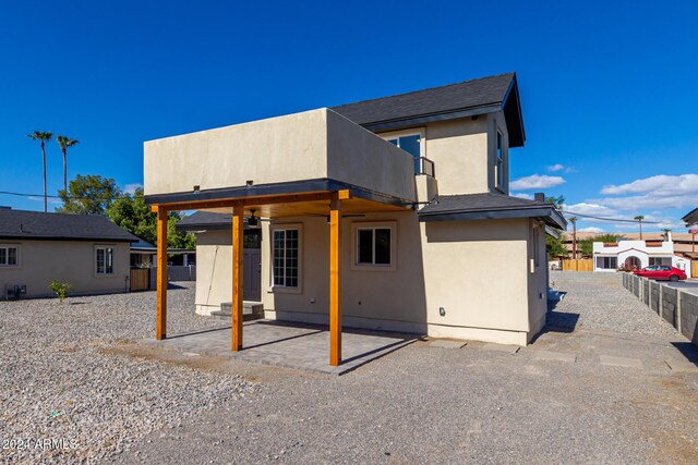 1921 E Yale St, Phoenix, AZ 85006 - rear view of house with a fenced backyard, a patio area, stucco siding, and a balcony