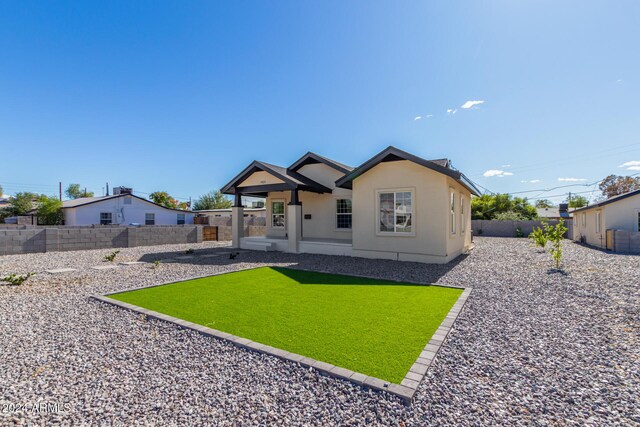 1921 E Yale St, Phoenix, AZ 85006 - back of house with a fenced backyard and stucco siding