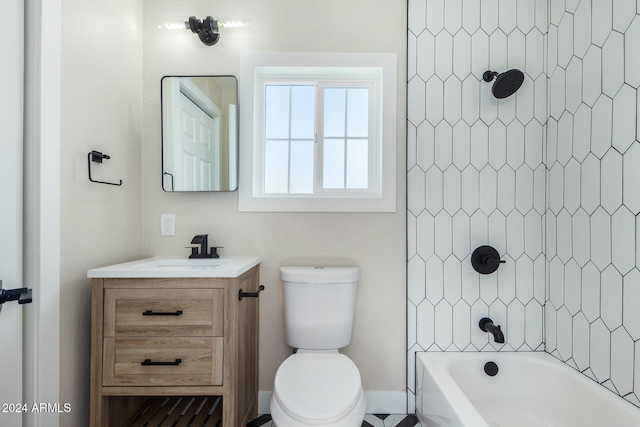 full bathroom with vanity, tiled shower / bath combo, and toilet