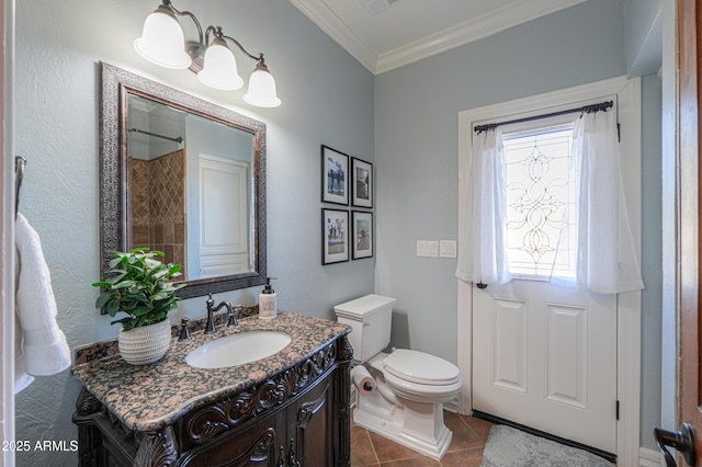 bathroom with crown molding, visible vents, toilet, vanity, and tile patterned flooring