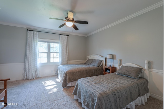 bedroom featuring carpet floors, baseboards, ornamental molding, and a ceiling fan