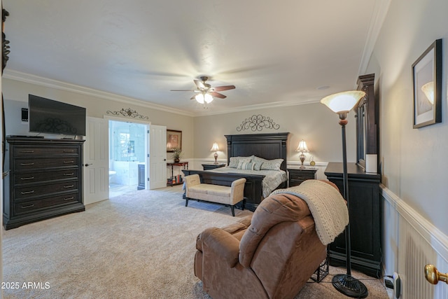 bedroom with a wainscoted wall, ceiling fan, crown molding, and light colored carpet