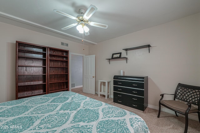 bedroom featuring light carpet, baseboards, visible vents, and a ceiling fan