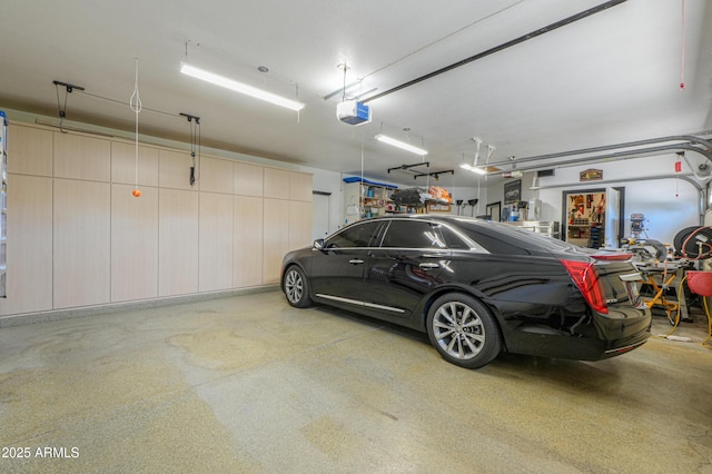 garage featuring a garage door opener