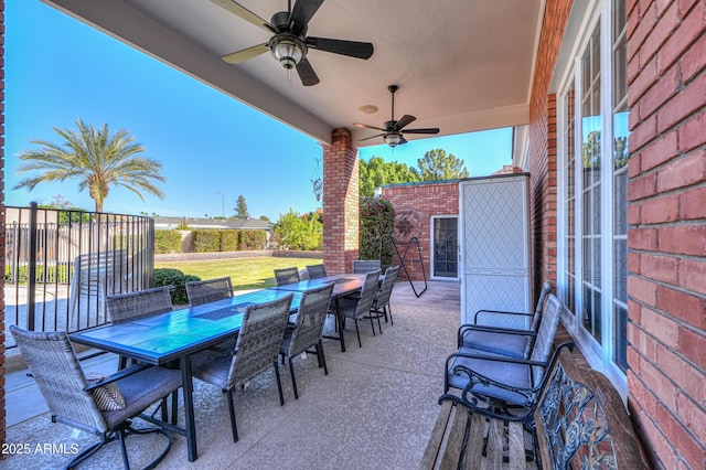 view of patio featuring a ceiling fan and outdoor dining area