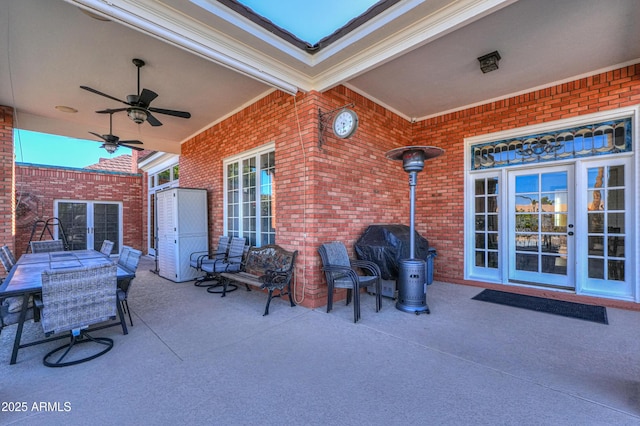 view of patio / terrace with ceiling fan, outdoor dining area, and a grill