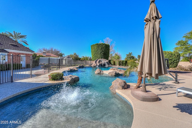 view of swimming pool featuring a fenced in pool and fence