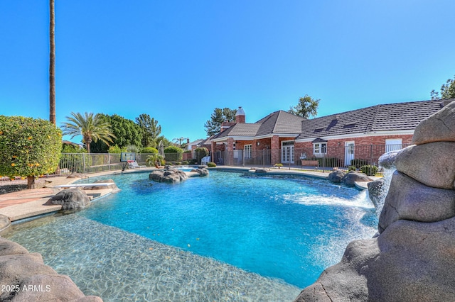 view of pool with fence and a fenced in pool