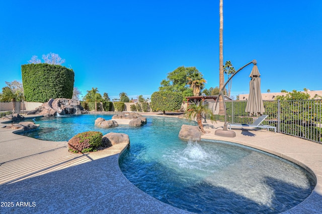 view of pool with a fenced in pool, a patio area, and fence