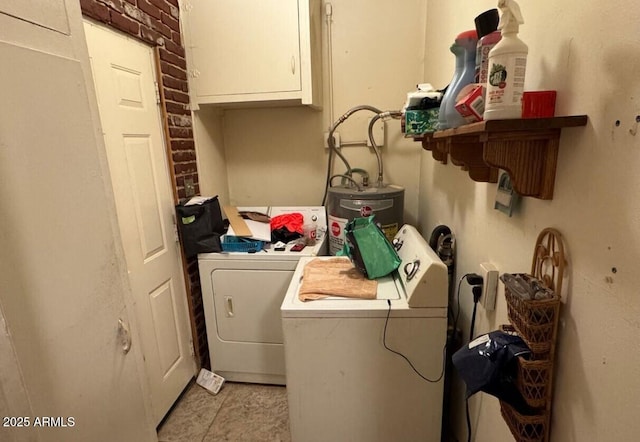 laundry room with water heater, separate washer and dryer, and cabinet space