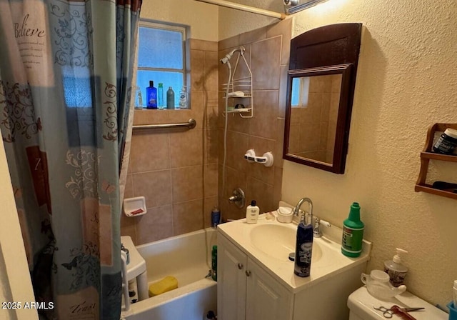 bathroom with toilet, a textured wall, shower / bath combination with curtain, and vanity