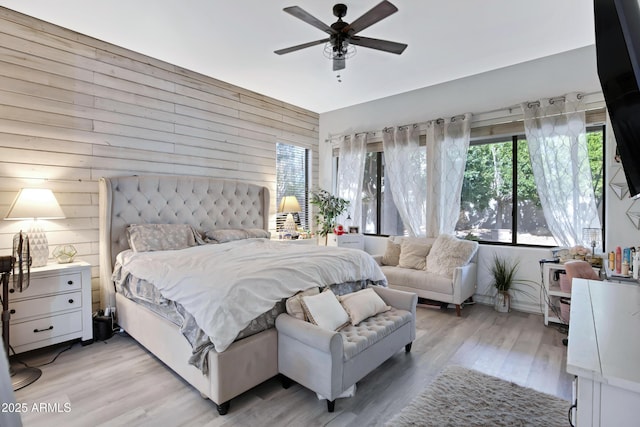 bedroom with light wood finished floors and ceiling fan