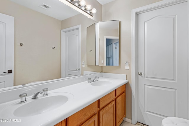 full bathroom with visible vents, a sink, and double vanity