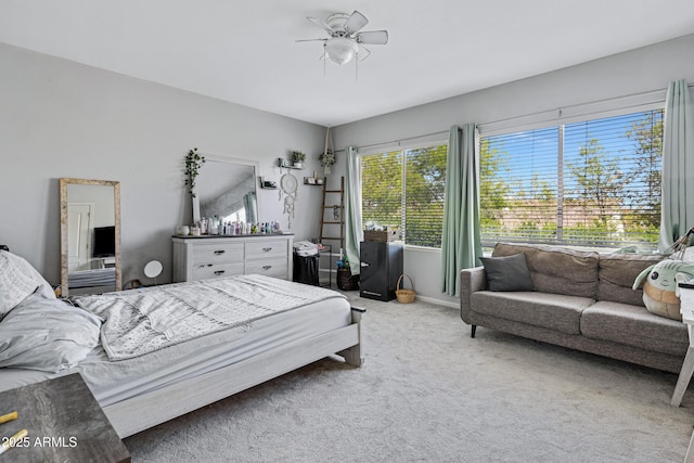 bedroom featuring carpet flooring, ceiling fan, and baseboards