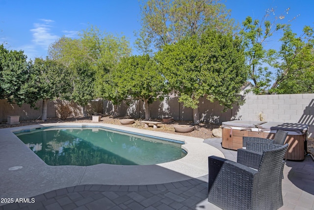 view of swimming pool with a fenced in pool, a patio area, a fenced backyard, and a hot tub