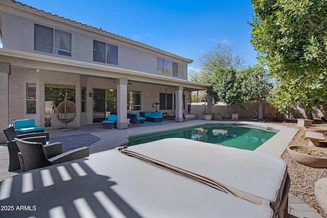 view of pool with a fenced backyard, outdoor lounge area, and a patio