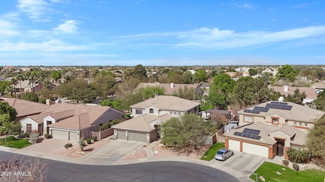 birds eye view of property with a residential view